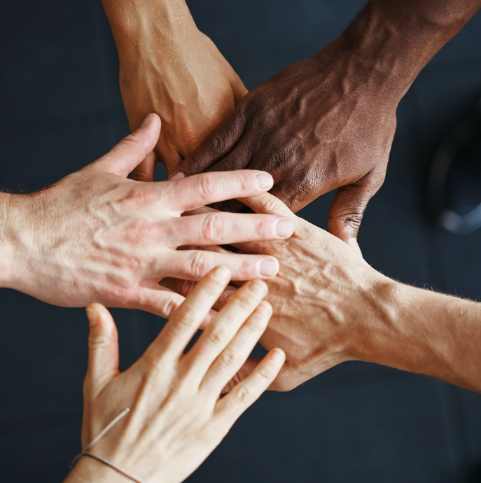 Diverse team - hands together in star